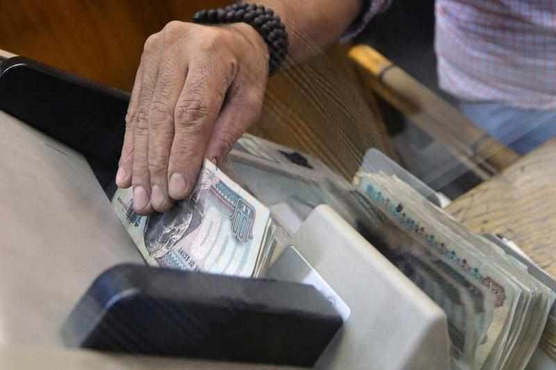 egypt,reserves,pressure,cards,withdrawal