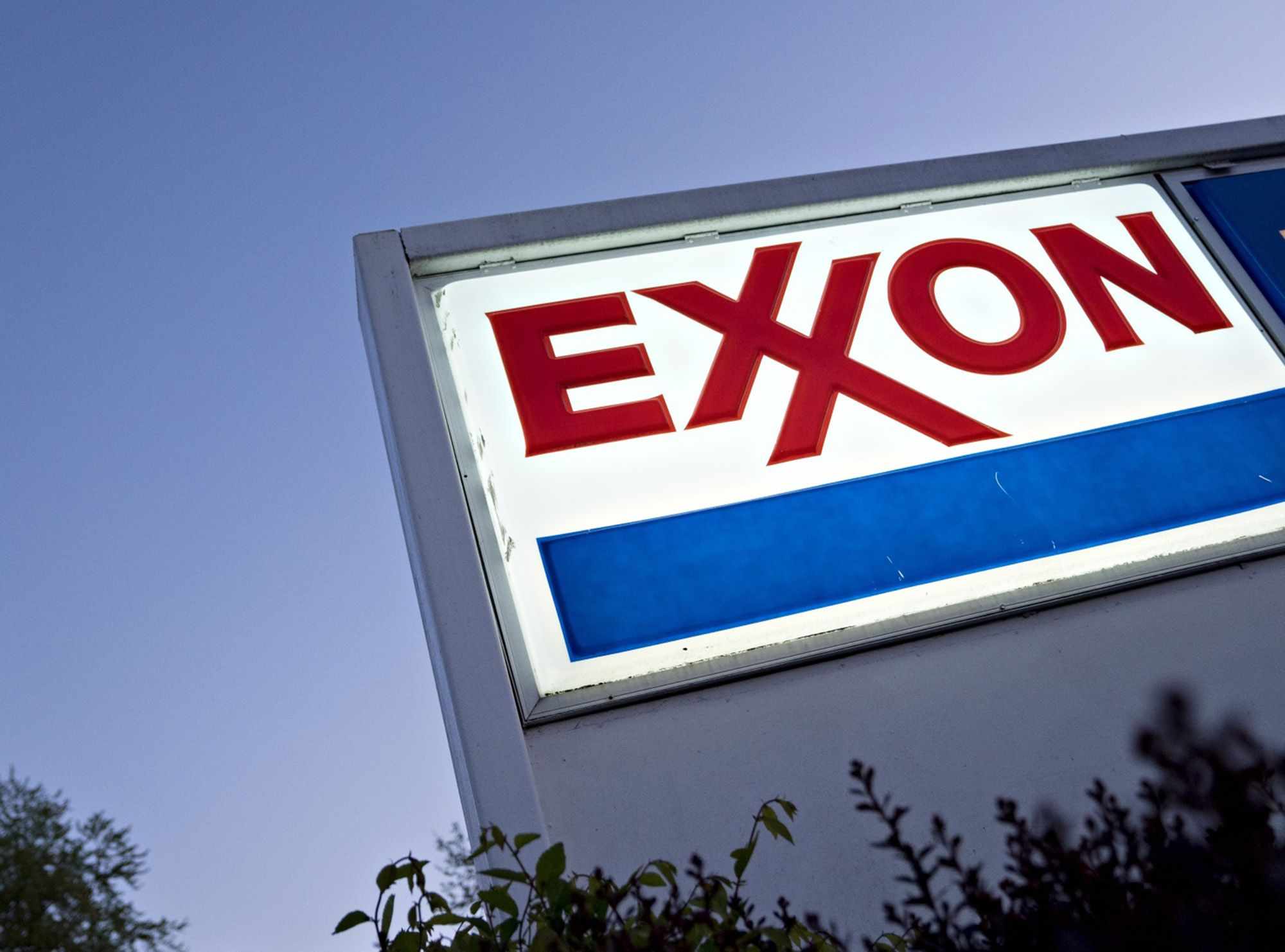 exxon profit crude losses share