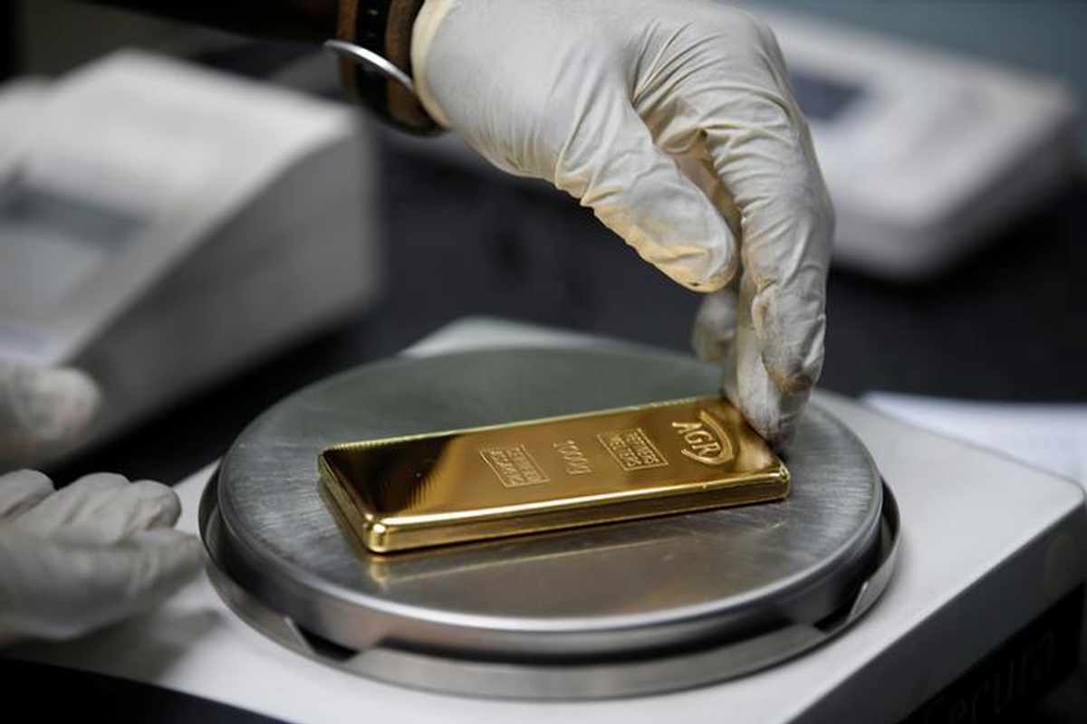 Gold eases on steady dollar, focus on Jackson Hole ...