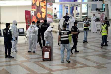 kuwait airport arrival quotas passengers