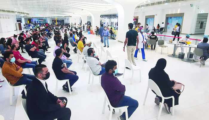 kuwait unvaccinated mall employees limbo