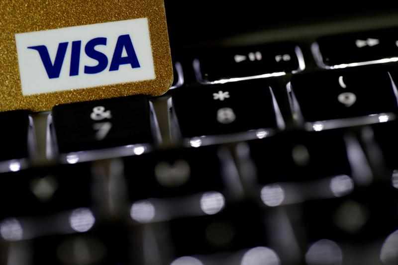 visa payment cryptocurrency reuters